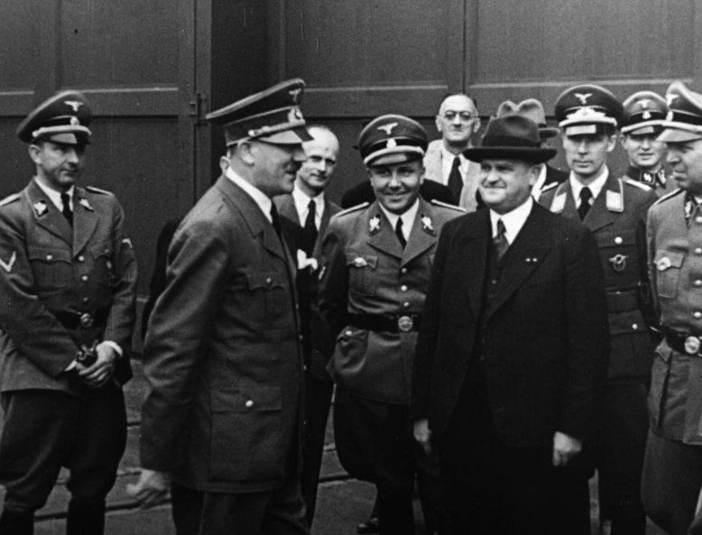 Adolf Hitler in front of the Krupp factory before his visit